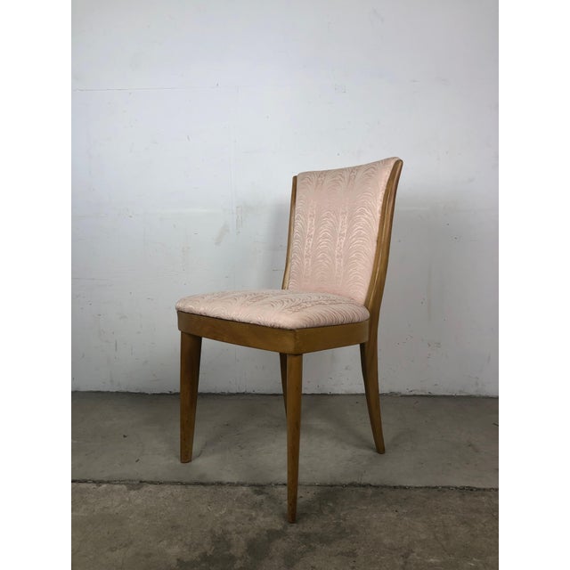 This mid century modern side chair by Heywood Wakefield features hardwood frame, vintage upholstery, original champagne...