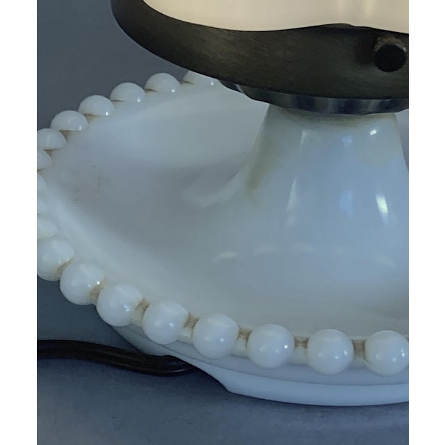 This might be an original combination of lamp and shade or perhaps something that a clever person put together. The reason...