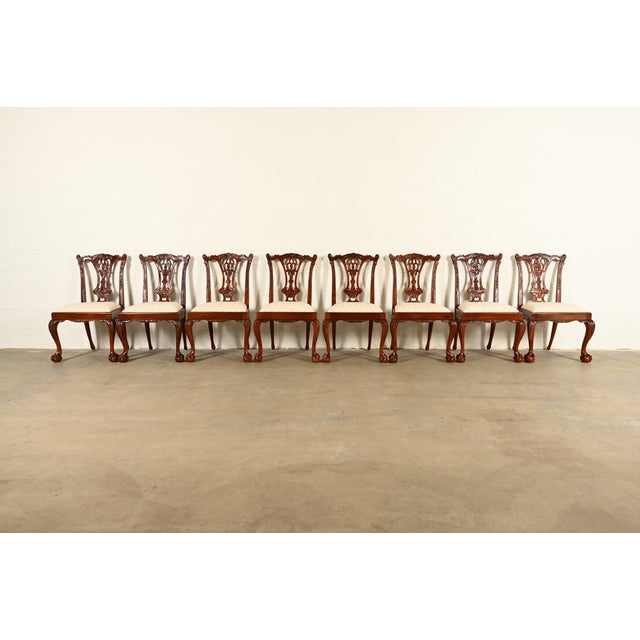 An outstanding set of eight Chippendale or Georgian style dining chairs In the manner of Baker Furniture USA, Circa 1980s...