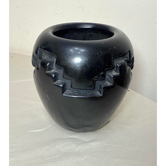 Up for sale is a nice quality antique handmade Santa Clara Native American Pueblo pottery vase. It's sculpted by hand with...