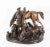 This is a superb vintage patinated bronze group of a hunter holding a fox over his hounds, dating from the late 20th...
