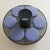 A 1950s French circular iron garden bench, designed as a sculptural ring with six round cushions upholstered in a soft...