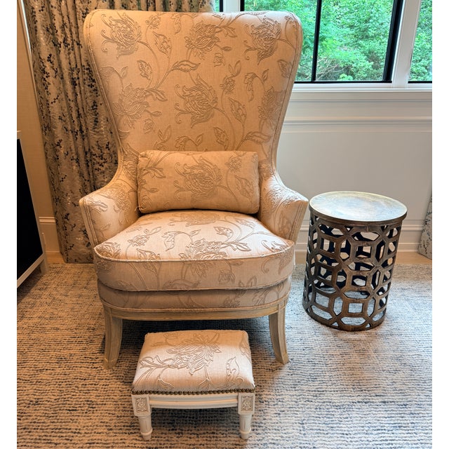 Tall Embroidered Wingback with Footstool A Clive Daniel Home purchase. A tonal linen fabric with embroidery in a washed...