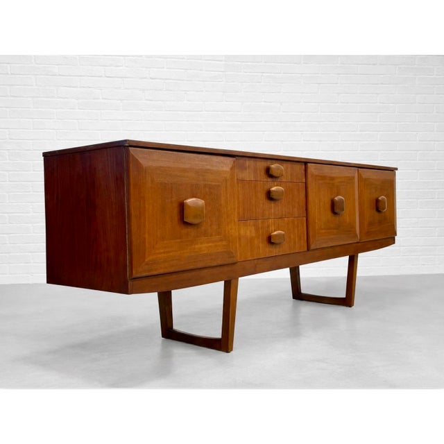 Wood Mid Century Modern Teak Credenza by Stonehill | Long Sideboard With Funky Sculpted Pulls and Sled Legs, Made in England, C. 1960’s For Sale - Image 7 of 18