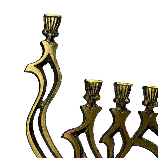 Sculptural vintage cast brass Hanukkah menorah by Oppenheim, Israel, dating to the mid-20th century. The striking openwork...