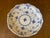 highly collectible porcelain piece in hand painted cobalt blue design and distinct open work laced border along the rim.