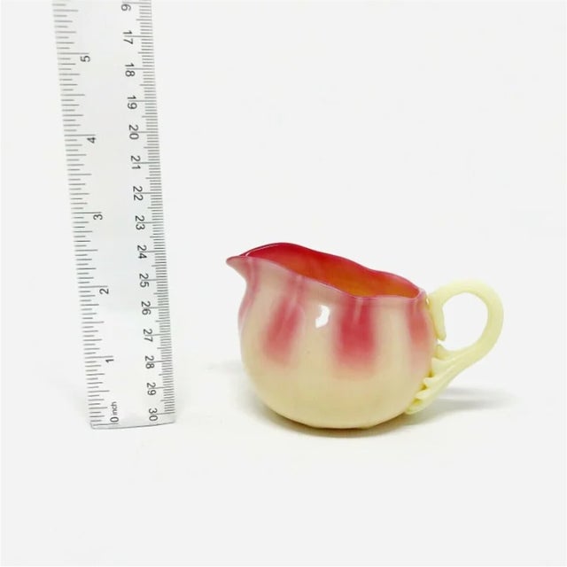 Pairpoint Ribbed Glossy Burmese Glass Creamer. In good condition as pictured, no chips or cracks.