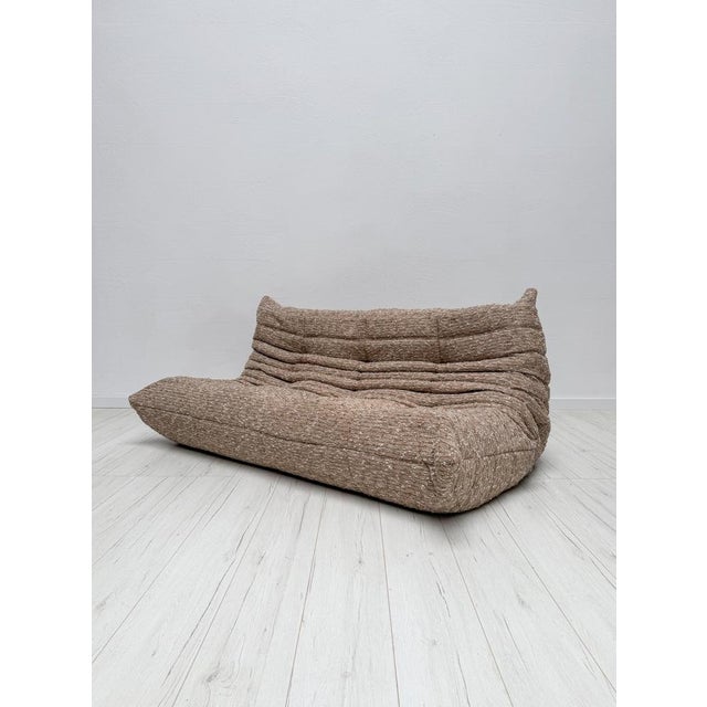 An absolute timeless design classic. Beautiful vintage original 3-seater Togo Sofa designed by Michel Ducaroy for Ligne...