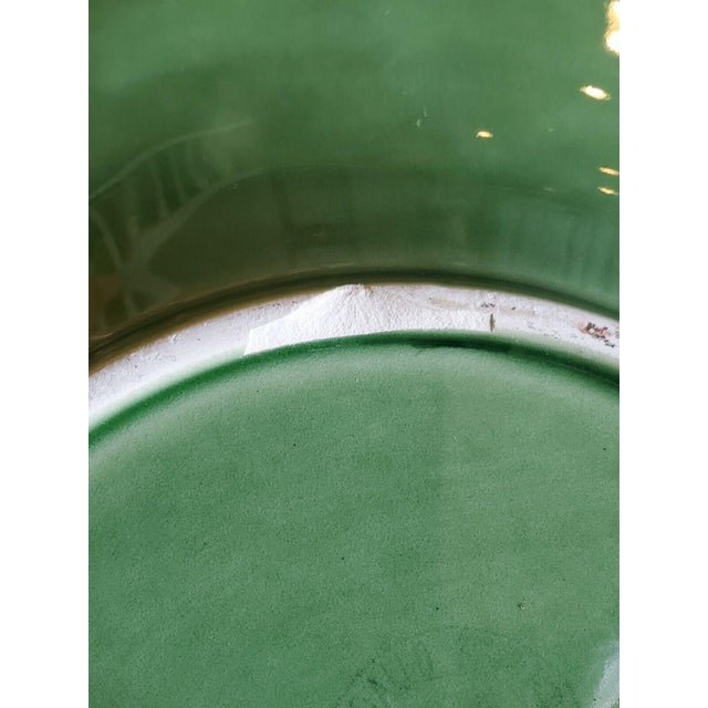 Bring a touch of nature to your table with this Bordallo Pinheiro ceramic serving bowl, crafted in the iconic green leaf...