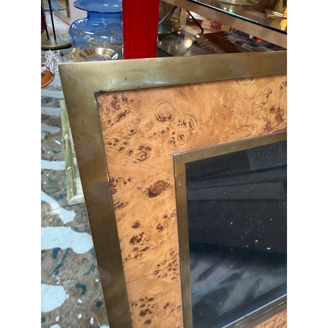 A vintage Italian picture frame featuring a beautifully figured burl wood veneer bordered by a brushed brass frame. The...