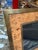 A vintage Italian picture frame featuring a beautifully figured burl wood veneer bordered by a brushed brass frame. The...