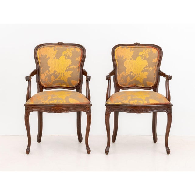 Pair of Louis XV Style Walnut Arm Chairs, with floral upholstered seat and backrest on four cabriole legs, "Oscar Deco...