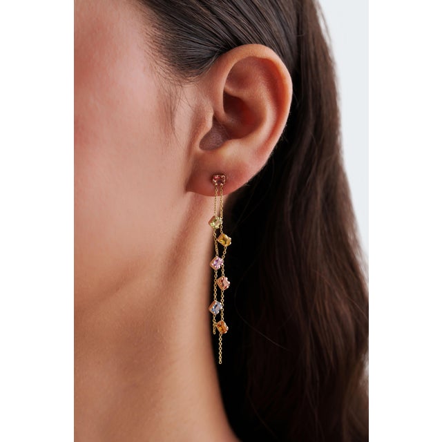 These modern chain drop earrings feature 3.3 carats of multi sapphires, set in 14K yellow gold. Each sapphire measures...