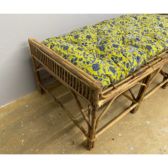 This bench or daybed is made of bamboo and cane and features a new cushion with a block print design.