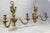 A fine pair of ormolu two branch wall light, circa 1900. Each with cast foliate decoration applied with classical figures....