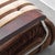 Armchair made in the 1970s. Brown fabric upholstery with wooden armrests and metal details. Plastic legs and base. Good...