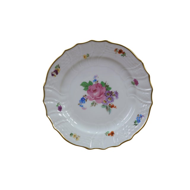 Eight vintage German Dresden Hutschenreuther porcelain plates from the Moritzburg series, featuring a floral design with...