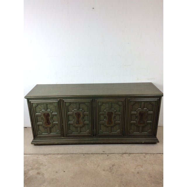 This mid century Mediterranean Revival credenza by Stanley Furniture features hardwood construction, original Jade finish,...