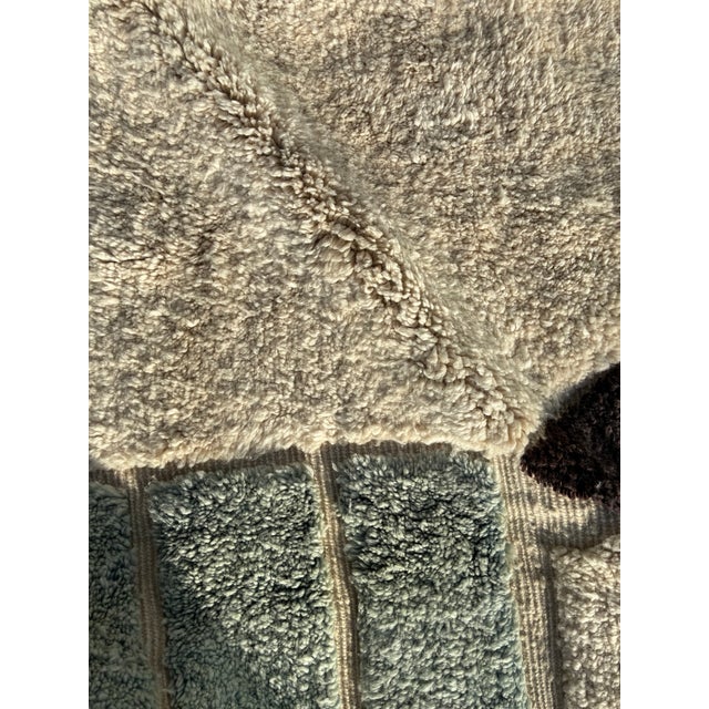 This authentic Beni Ouarain rug is handwoven in the Middle Atlas region of Morocco by skilled Berber artisans using...