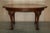 This is a lovely antique circa 1920's English Walnut hand carved Claw & Ball foot dining table A very well made and...
