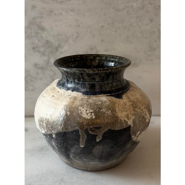 Vintage studio pottery vessel or jar with a white, grey and black coloration characteristic of the Raku firing technique....