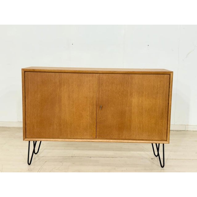 Unique mid-century piece of furniture with a modern twist. The frame is an original part from the sought-after IKEA MTP...