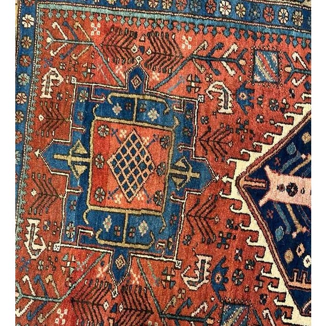 A striking antique Heriz rug, celebrated for its powerful geometry and bold graphic presence, making it an exceptional...