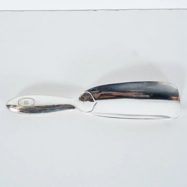 This elegant shoe horn was realized in the United States by Tiffany & Co.- one of America's most illustrious and storied...