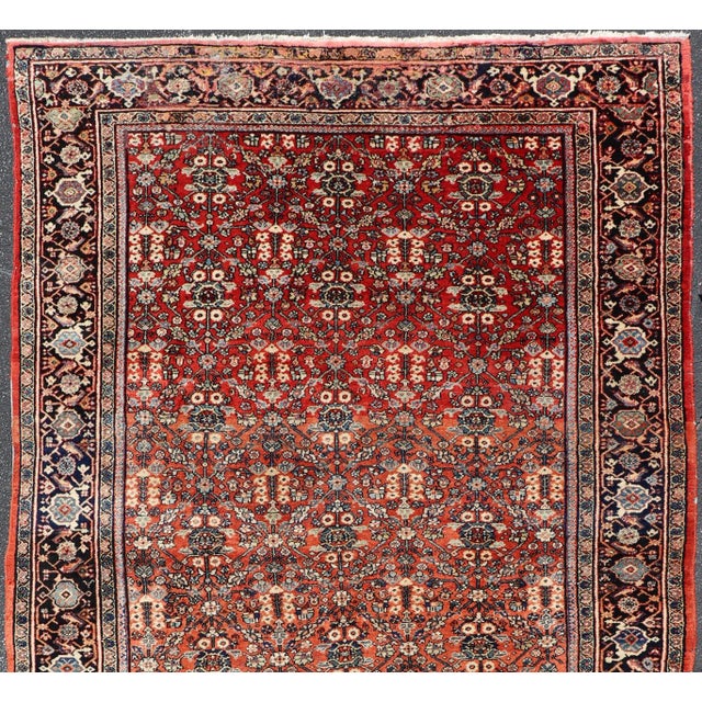 Measures: 7'2 x 12'2 Antique Sultanabad Rug with Rich Red Field, Allover Design and Navy Blue Border 7'2 X 12'2. Keivan...