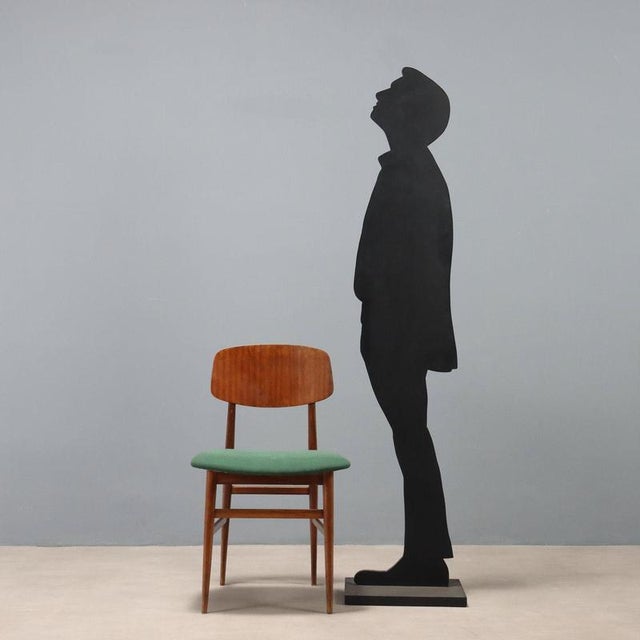 Vintage Italian-made wooden chair with original green fabric seat. This piece is attributed to the mentioned...