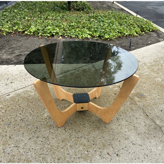 Beautiful Luna cocktail table with smoked glass top. No visible maker's mark