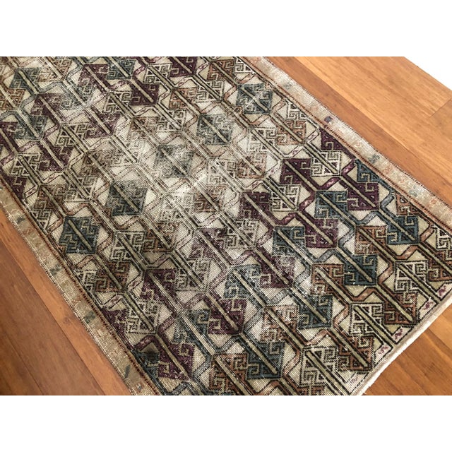 A striking example of mid-century textile design, this vintage Isparta rug brings bold geometry and a refined color...