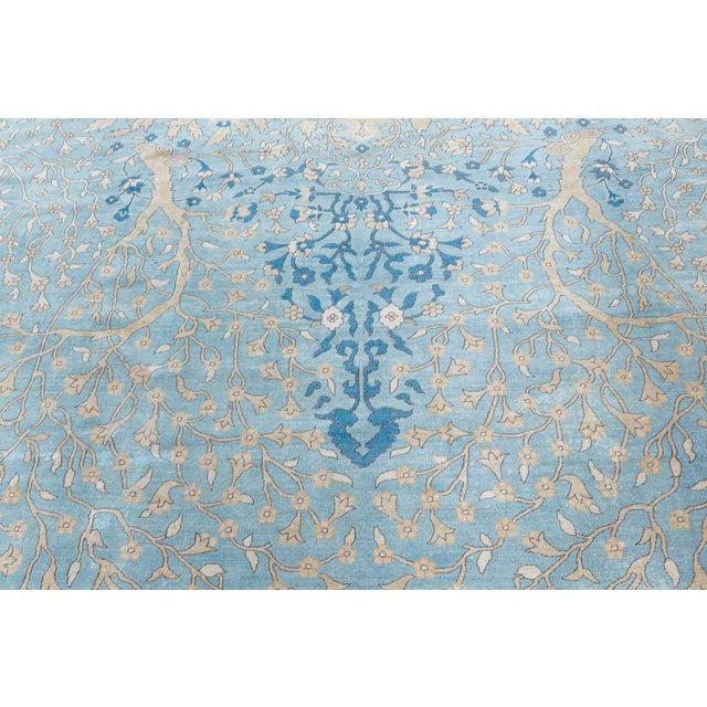 An early 20th century Indian antique rug from our Indian Rugs collection, the celadon green field with a subtle central...
