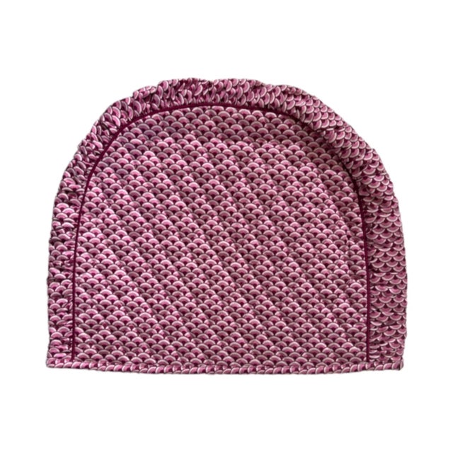 A vintage Royal Copenhagan quilted tea cozy or tea pot warmer in a scalloped pink fabric with deep red piping. 13"x11"....