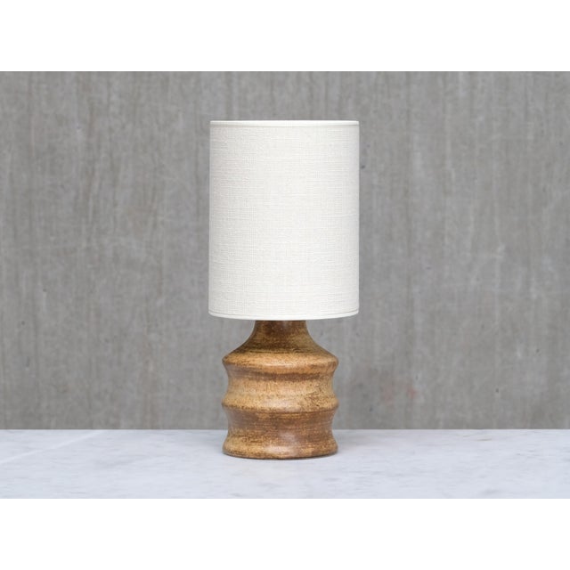 This rare table lamp was designed by Bruno Karlsson and produced by Ego Stengods Ateljé in Sweden during the 1960s. The...