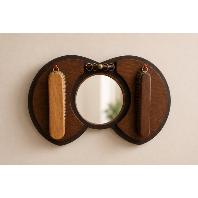 An authentic vintage hallway mirror in solid oak, designed in the distinctive Art Deco style of the Amsterdam School....