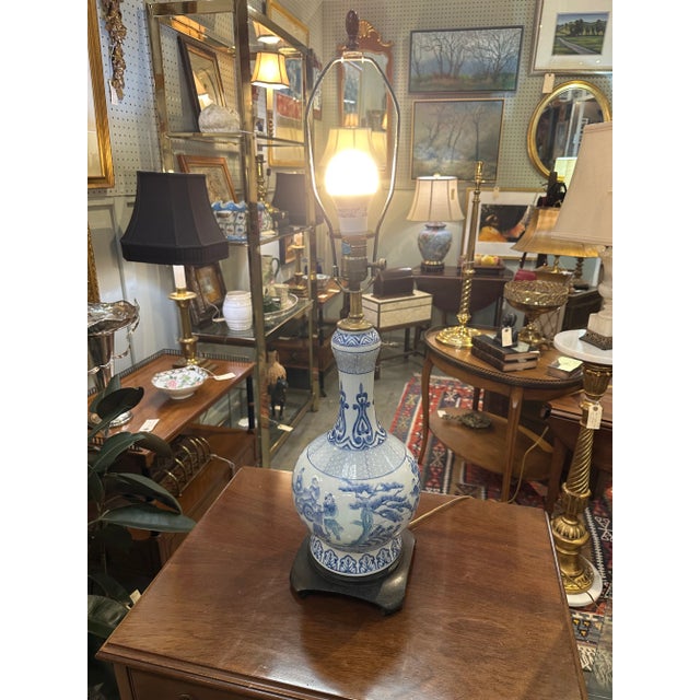 Vintage Maitland-Smith blue and white porcelain lamp on a wooden base. Shade not included.