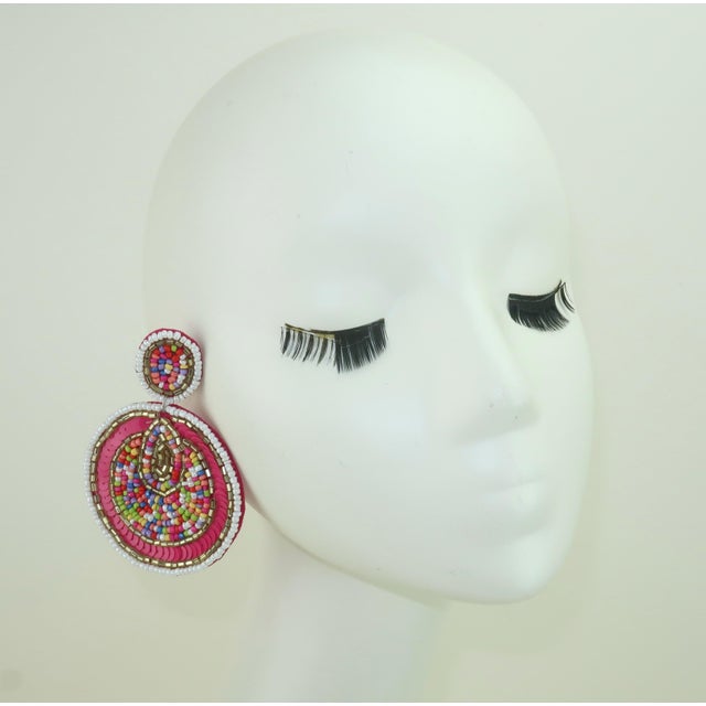 Both colorful and festive…these Kay Lee sequin and bead earrings are just a party waiting to happen. The circular dangle...