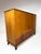 1930's Swedish Grace Cabinet. 3 large doors conceal interior adjustable shelves and small drawers. Mixed woods create...