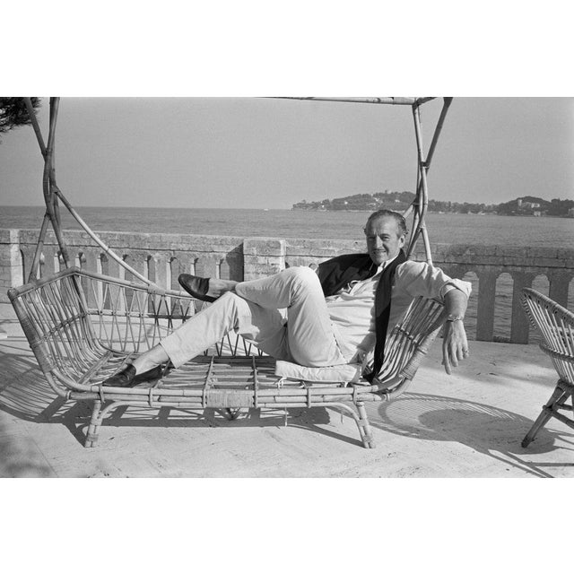 David Niven British actor David Niven (1910 - 1983) relaxes on a whicker sun-lounger by the sea. (Photo by Larry...