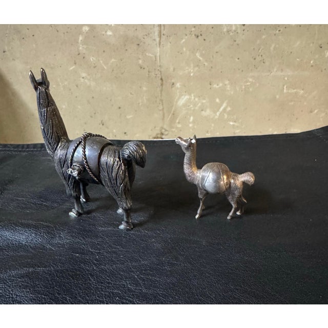 Pair of Sterling Silver (Marked 925) Peruvian Llama Figurine. Signed 38g(small),253g(large). Dimensions:3.5”h x3”w x...
