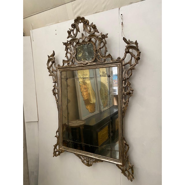 Italian 19th c. hand carved silver leaf mirror. Original cut glass mirror. 44'l x 64'h 37-107