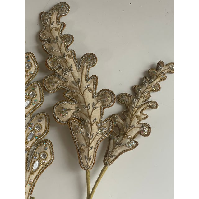 Set f 6 curtain Tiebacks in a shape of leaves with sequins.