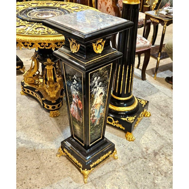 Elevate your interior with this magnificent French Empire-style pedestal, expertly crafted in a striking black lacquer...