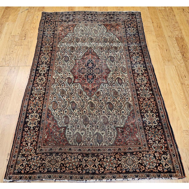 "An exceptional late 19th century Persian Farahan Sarouk area rug of rare distinction, featuring an unusual allover...