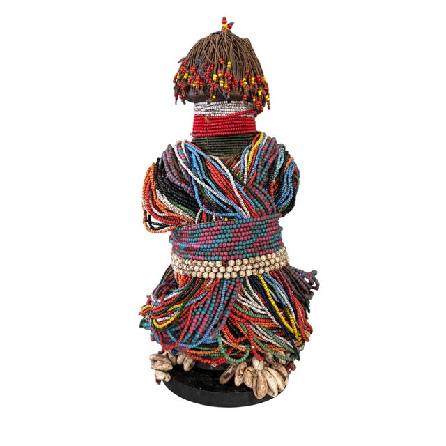 Superb large Rare African fertility doll decorated with multiple layers of trade glass beads and cowrie shells, minor...