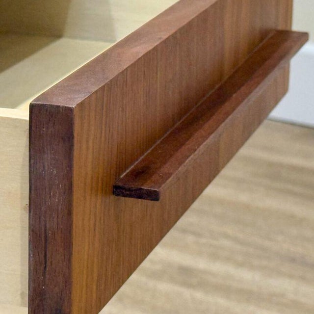 A striking pair of vintage mid-century bedside tables, beautifully crafted in warm, richly figured walnut . Each table...