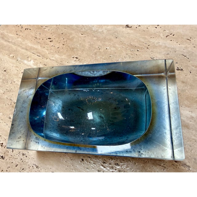 Striking Murano glass ashtray designed by Flavio Poli, featuring a sculptural rectangular form with a deep oval well. Its...