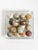 Decorative set of polished marble and natural stone spheres, France, circa 1970s. Each sphere features distinctive...