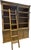 This is a faded-wash oak bookshelf. It is incredibly well made: each shelf can be adjusted in height with a wooden support...